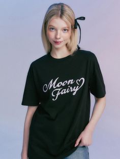 This is a casual and trendy top by MOONFAIRY that is made out of high quality and sturdy material. With distinctive mood of the design and comfortable wear, you can style it for your casual daily outfit.- Unique graphic artwork detail- Soft and sturdy cotton 100% fabric- Young and feminine mood Black Harajuku Style Crew Neck Top, Black Harajuku Top With Letter Print, Cute Black Tops With Letter Print, Cute Black Tops With Text Print, Cute Black Tops With Graphic Print, Cute Black T-shirt With Graphic Design, Cute Black Graphic T-shirt, Cute Black T-shirt For Spring, Cute Black Short Sleeve T-shirt