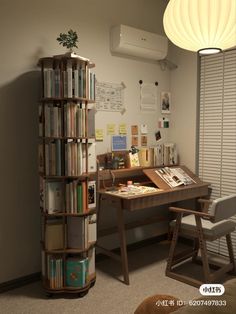 a room with a desk, chair and bookshelf full of books in it