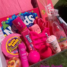 a pink box filled with lots of different items