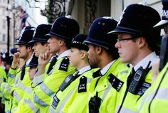 a row of police officers standing next to each other