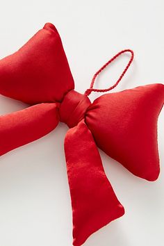 a red bow tie on top of a white table