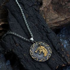 This pendant necklace showcased two designs, The wolf and Slavic. Wolf was known to be a sacred animal in Norse mythology. They were not seen as threatening hunters, but rather as powerful helpers and guides. Wolves were positive symbols of transformation. In addition, The Kolovrat, Swastika is the foremost symbol representing Rodnovery amongst East Slavic peoples and traditions. Contains both straight and curved lines and has crossing lines. This pendant necklace is made of solid stainless stee Pendant Necklace Outfit, Witcher Medallion, Wolf Pendant Necklace, Viking Wolf, Fandom Jewelry, Mens Necklace Pendant, Wolves Pendants, Futhark Runes, Wolf Necklace