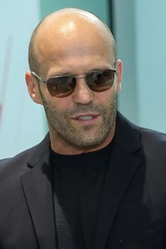 To get Jason Statham’s style bald men look, you can shave your head or try a short stubble look. However, you’ll need to grow out your stubble just slightly and maintain with a longer guard on your electric beard trimmer to get Statham’s beard. Along with his incredible acting skills, he has also never had any problems with women, according to his fiancee Rosie Huntington-Whiteley. Jason Statham Hair, Bald Men Style Fashion Casual, Jason Statham With Hair, Bald Fade Haircut Men Black, Bald Men Style Fashion, Men Balding Hairstyles, Bald Men Style Fashion Outfits, Bald Hairstyles Men, Bald Fade Haircut Men