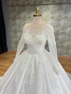 Opulent Regal Princess Wedding Gown with Sheer Illusion Sleeves and Exquisite Lace Appliques Lebanese Wedding Dress, Illusion Sleeves, Lebanese Wedding, Dramatic Silhouette, Princess Wedding Gown, Illusion Neckline, Luxurious Fabric, Romantic Look, Princess Wedding