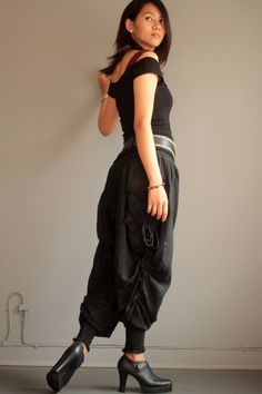 "Our new funky harem pants. A simple version for daily style! Made with super soft and comfy linen/cotton fabric. The fabric is flowy, has great stripe texture and semi-sheer. Elastic back waist. Drop-crotch harem pants style. Shirring cuff hem.gathered in small pleats around the waist to create volume. Special detail on the side with drawstring along the leg that you can adjust and get a different look. Big side pockets.The shirring hem allow you to wear the pants full length or Capri length. Y Trendy Black Cotton Harem Pants, Fitted Cotton Harem Pants For Festivals, Fitted Cotton Harem Pants, Casual Fitted Harem Pants For Festival, Baggy Cotton Pants For Alternative Fashion, Trendy Baggy Harem Pants With Elastic Waistband, Casual Drop Crotch Pants For Festival, Baggy Casual Parachute Pants For Festivals, Casual Baggy Parachute Pants For Festival