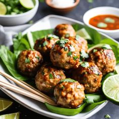 meatballs with sauce and chopsticks on a plate