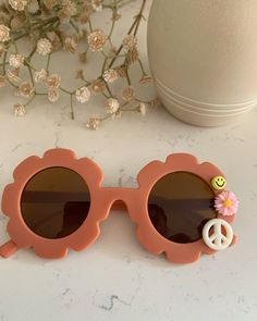 Ready to ship! How cute are these rust flower shades with the cutest accents. This color is absolutely perfect for fall! We can add a name on the top, just leave a note in the personalize box at checkout! Sunglasses are very versatile in sizing and will fit babies, toddlers, kids and pre-teens. Sunglasses For Kids, Flower Sunglasses, Kids Sunglasses, Happy Mail, Personalised Box, Flower Child, Kids Accessories, The Cutest, Sunglasses Accessories