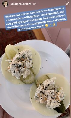 two pickles on a white plate with some type of appetizer in the middle