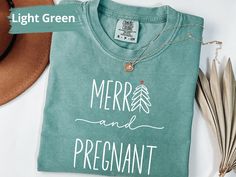 Celebrate the season with our Christmas Merry and Pregnant Shirt! This Minimalist shirt is perfect for a festive baby announcement. Available in Comfort Colors Shirt, it's an ideal gift for moms-to-be to share their joyful news in style. Perfect for Christmas gatherings and holiday photos! 👉 Unisex Comfort Colors® 1717 T-shirt Comfort Colors introduces its garment-dyed t-shirt; a fully customizable tee made 100% with ring-spun cotton. The soft-washed, garment-dyed fabric brings extra coziness t Pregnant Shirt, Minimalist Shirt, Minimalist Shirts, Xmas Tees, Christmas Gathering, Mom To Be, Pregnancy Reveal, Minimalist Christmas, Pregnant Mom