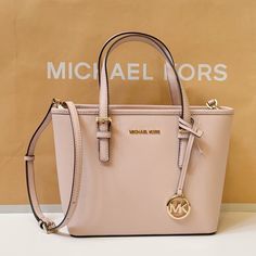 New With Tag Michael Kors Jet Set Travel Xs Carryall Tote Top Zip Satchel Shoulder Bag Saffiano Leather Pink (Powder Blush) 100% Authentic Retail: $328.00 Plus Tax **Please See The Measurement For The Size** !!No Dust Bag!! Michael Kors Logo At Front Gold Toned Hardware Zip Top Closure Slip-In Pocket One Mk Charm Custom Fabric Lining 1 Slip-In Pocket, 1 Zipper Pocket 9"(Top) 11"(Bottom) X 7.75" (H) X 4.25"(D) Strap: 5", 24" Very Clean, Smoke-Free And Pet-Free Environment. Michael Kors Handbags Pink, Pink Powder, Michael Kors Logo, Carryall Tote, Powder Blush, Pink Tote, Handbags Michael Kors, Kors Jet Set, Zip Top