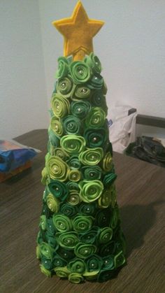 a christmas tree made out of rolled up paper