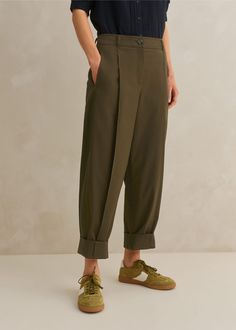 Cotton-Blend Tapered Pleat Pant Dark Olive Elegant Olive Bottoms For Workwear, Olive Trousers For Workwear, Olive Relaxed Fit Bottoms For Work, Olive Tapered Leg Pants For Spring, Pleated Pants With Relaxed Fit And Tapered Leg, Modern Tapered Pants For Fall, Fall Pleated Khaki Bottoms, Spring Olive Tapered Leg Pants, Ankle-length Pleated Cotton Pants