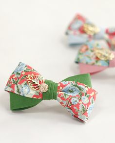 three bow ties with different designs on them