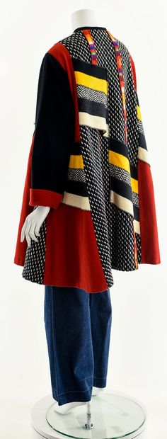 "- One of a kind Vintage Rainbow Wool Trapeze Statement Coat -Vintage Art-to-wear highly collectible early 90s color block pure wool & mohair swing coat by COLORATURA -Handcrafted, gorgeous patchwork textile art winter coat with flawless black satin lining -Black metal snaps down the front -Deep mohair pockets. -Incredibly warm, comfortable, -mood enhancing, a magnet for compliments Brand/Designer/Label: COLORATURA Fits like: One Size Fits Most (Depending on Desired Fit) Material: Wool Mohai Patchwork Textile Art, Art Coat, 90s Color Block, Mohair Coat, 1940s Suit, Jacket Art, Retro Suits, Colorful Jacket, Dress Form Mannequin