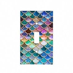 a light switch cover with colorful fish scales on it's side and the words luxury mulitcolor gl by flowers - n - love