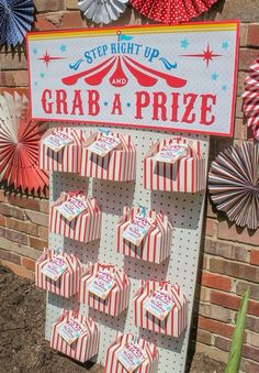 there is a sign that says grab a prize in front of some paper fan decorations