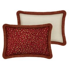 two red and pink pillows with fringe trims on the sides, one has a flower pattern