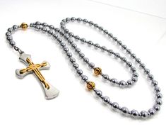 "More Rosaries can be found here: https://www.etsy.com/shop/MiaPatrino?ref=hdr_shop_menu&section_id=20503196 This  Woman's Beaded Rosary Necklace is handmade from Natural Gemstone: Hematite Beads 6mm , Stainless Steel Cross and steel cord.  Length: Loop 67cm (26.5\") + Drop 8cm (3\") + Cross size: 3 x 5 cm  ( 1.2\" x 2\") The size can be customized. All metal materials are lead and nickel free. The rosary comes in a gift box. You may have a piece created just for you!  Please send us a message f Necklace Gift Box, Hematite Beads, Men's Necklace, Bracelet Clasps, Blue Agate