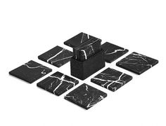 black and white marble coasters are arranged in the shape of squares