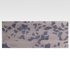 an animal print rug on a white background