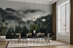 a dining room with mountains and trees painted on the wall