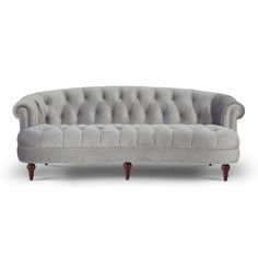 a gray couch sitting on top of a white floor