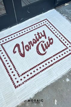 a mosaic tile door mat with the word honesty club on it in red and white