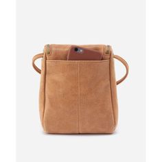 Expertly crafted from buffed leather, the HOBO Fern Crossbody in Whiskey boasts a timeless design that is both durable and stylish. With its adjustable strap and multiple pockets, this bag offers both comfort and functionality, making it the perfect accessory for any occasion. Why You'll Love It Fern has a double-zipper closure for easy access, an endlessly adjustable strap, and an exterior slip pocket for your phone. Features: 6" W X 7.5" H X 2" D Sandlewood Lining Interior Back: Zip pocket Exterior Back: Signature phone pocket Fits your phone Brushed Antique Brass Hardware Zip Closure Up to 26" Strap Drop Solid leather single strap Adjust the strap's knotted ends to find your perfect fit Model Height: 5'11" Care Suede & Leather Protector Dark Tan Leather Crossbody Shoulder Bag, Leather Cognac Bag With Cell Phone Pocket, Cognac Leather Bag With Cell Phone Pocket, Harry Potter Candy, Sage Leaf, Queens Jewels, Mantra Bands, Beach Towel Blanket, Blue Q