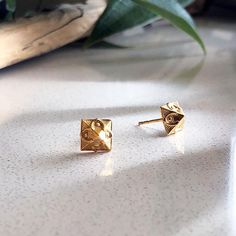 Here's our iconic take on the classic pyramid stud earrings. Wear these gold studs when you want to feel like a badass but still look like an adult. Perfect for giving your ethical wardrobe a little indie fashion flair. 18k gold dipped earrings Sustainably cast from 70% recycled stainless steel Measures 10 mm wide and 10 mm high Post closure Designed with love in Seattle, ethically made in Thailand Free shipping on orders over $75 Fast & Friendly Returns Ring Pendant Necklace, Sustainable Jewelry, Gold Dipped, Indie Fashion, Mens Jewelry Bracelet, Tablet Accessories, Recycled Sterling Silver, Gold Plated Earrings, Everyday Jewelry