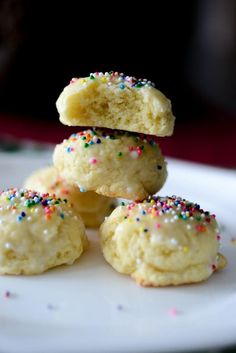 several cookies stacked on top of each other with sprinkles