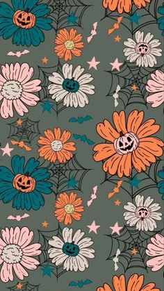 an orange and blue flower pattern on a gray background with white stars, pumpkins and spider web