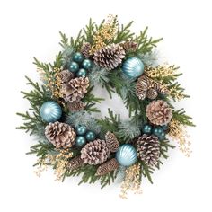 a christmas wreath with pine cones, blue balls and greenery on white background photo