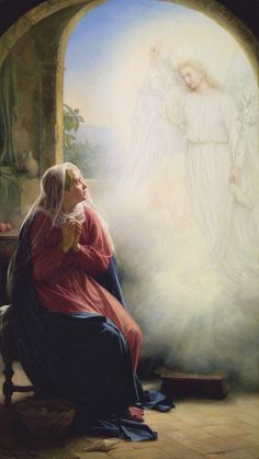 an angel kneeling down next to a woman