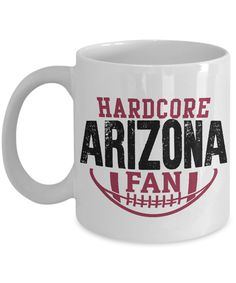 a white coffee mug with the words, hard core arizona fan and football on it