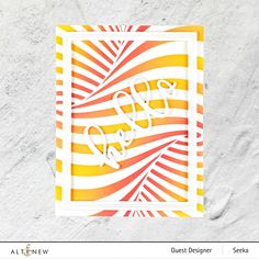 an image of a card with the word love in white and orange stripes on it