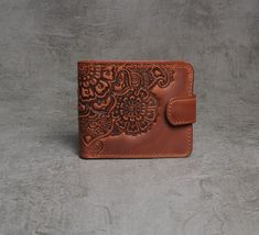 "Full grain leather wallet, soft leather wallet, leather billfold, small wallet women's, brown wallet, embossed billfold, pocket wallet, billfold wallet, gift for her Lovely embossed billfold wallet made from soft durable calf leather of premium quality. Dimensions: 9.5x11 cm (3.7х4.3\") 2 cash pockets, 4 card slots, 1 coins pocket, 1 photo pocket Like all of our products, this wallet will last for years, at the same time without losing its appearance. Please note! Since each item in my shop is handmade, some elements and tinctures may slightly differ." Vintage Brown Bifold Wallets As Gift, Vintage Brown Bifold Wallet As Gift, Brown Embossed Wallets For Daily Use, Brown Embossed Wallet For Daily Use, Brown Embossed Leather Wallet, Brown Embossed Wallet, Embossed Brown Wallets As Gift, Brown Embossed Wallet For Everyday Use, Full Grain Leather Wallet