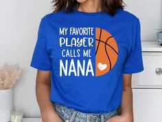 Get Ready for Game Days this Basketball Season with this Basketball Nana Shirt for Women! Cute basketball grandma tee for cheering in the stands for your favorite team and player on the court.  Depending on availability we offer Bella Canvas and Gildan Unisex (Softstyle) Tee's. Please leave a note at checkout if you have a brand of preference.  This t-shirt is everything you've dreamed of and more. It feels soft and lightweight, with the right amount of stretch. It's comfortable and flattering f Gigi Shirts, Nana Shirts, Basketball Season, Grandma Shirt, Basketball Game, Grandma Shirts, Game Day Shirts, Basketball Games, Online Branding