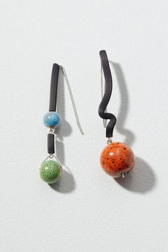 Rubber & Ceramic Earrings - Far from ordinary, these earrings join black rubber tubing, colorful ceramic beads and sterling silver in asymmetrical design. Sterling silver ear wires. Black Artsy Drop Earrings, Artsy Black Earrings With Ear Wire, Ceramic Bead Jewelry, Earring Styles, Colors Of Fall, Ceramic Earrings, Asymmetrical Earrings, Fall 24, Colorful Ceramics