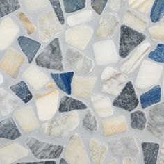 a close up view of some kind of mosaic tile with blue, white and grey colors