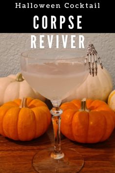 the halloween cocktail is served in a coupe glass and garnished with white wine