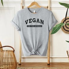 The vegan t-shirt is an essential item for all animal advocates. This t-shirt soft and lightweight, with the right amount of stretch. It's comfortable and flattering for all. Our heather t-shirts are a super-comfortable and soft blend material. White tee: 100% cottonHeather tees: 52% cotton, 48% polyester Pre-shrunk fa Vegan For The Animals, Menu Designs, University Tees, Vegan Clothing, Vegan Shirt, Vegan Animals, Animal Tshirt, College Fashion, The Animals