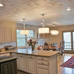 a large kitchen with an island in the middle