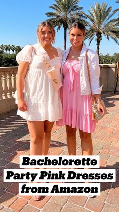 two young women standing next to each other on a brick walkway with palm trees in the background