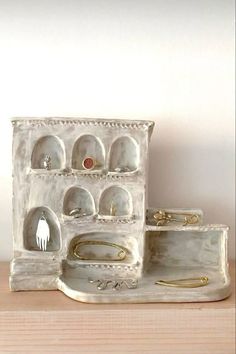 an assortment of jewelry sits on a table