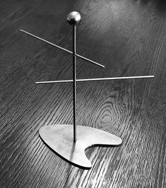 a metal object sitting on top of a wooden table