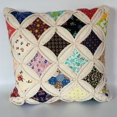 a decorative pillow made out of patchwork material