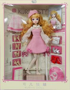 a barbie doll in a pink dress and hat with accessories for her to be dressed up