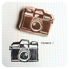 a rubber stamp with a camera on it