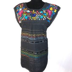 High quality Handmade beautiful Mexican blouse, beautiful and unique Pieces made by Mexicans artisans -Made: cotton fabric -handmade -traditional floral embroidery - message me for any questions Medium: 19in across shoulders, 19.5in across chest and 25in long Large: 21 in across shoulders, 20in across chest and 30in long Visit us at Omxboutique.com Traditional Multicolor Embroidered Cotton Dress, Folk Style Embroidered Cotton Dress, Folk Style Cotton Dress With Embroidered Neckline, Multicolor Cotton Dress With Embroidered Neckline, Cotton Embroidered Dress With Floral Embroidery For Fiesta, Traditional Cotton Embroidered Fiesta Dress, Black Cotton Folk Embroidered Dress, Traditional Cotton Dress With Multicolor Embroidery, Traditional Embroidered Cotton Dress For Fiesta