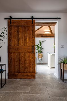 an open wooden door leading to a living room